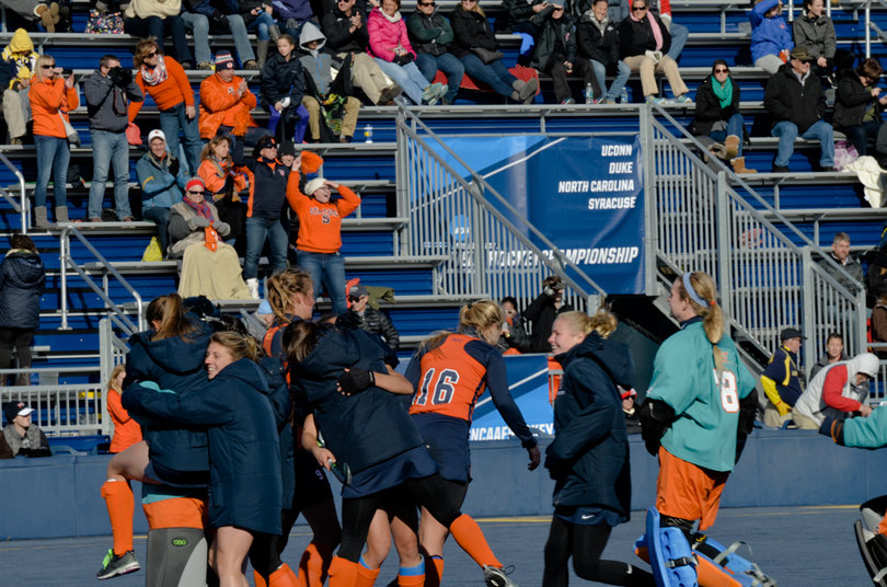 Top-seeded Syracuse celebrates its 3-1 win over Connecticut to advance to Sunday's national championship.