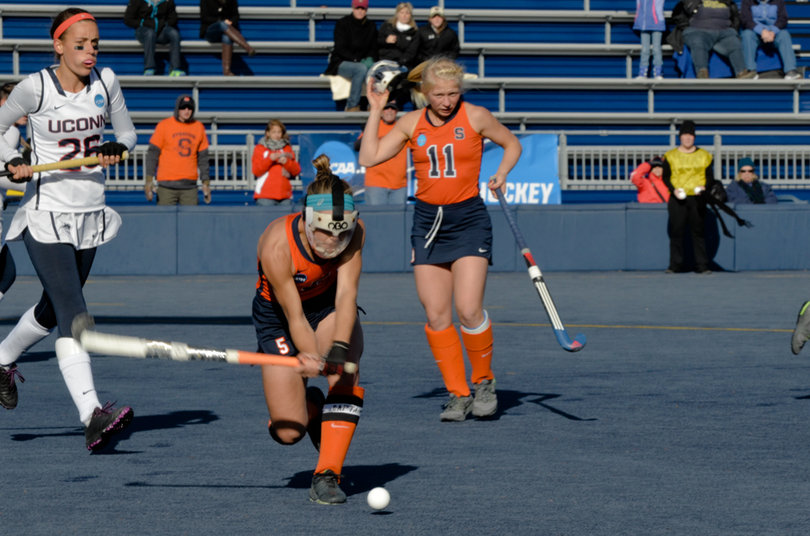 Alyssa Manley knocks away a Connecticut shot, thwarting a penalty corner.