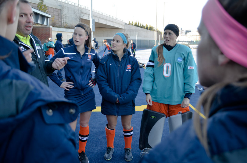 Captains (from left to right) Emma Russell, Alyssa Manley and Jess Jecko watch the coin toss before the game. 