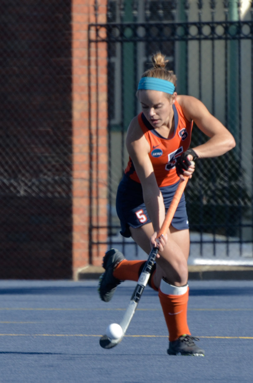 Senior midfielder Alyssa Manley stick-handles on offense for the Orange.