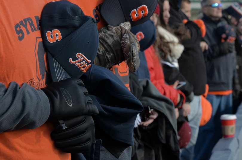 Orange fans take their hats off for the national anthem before the game begins. 