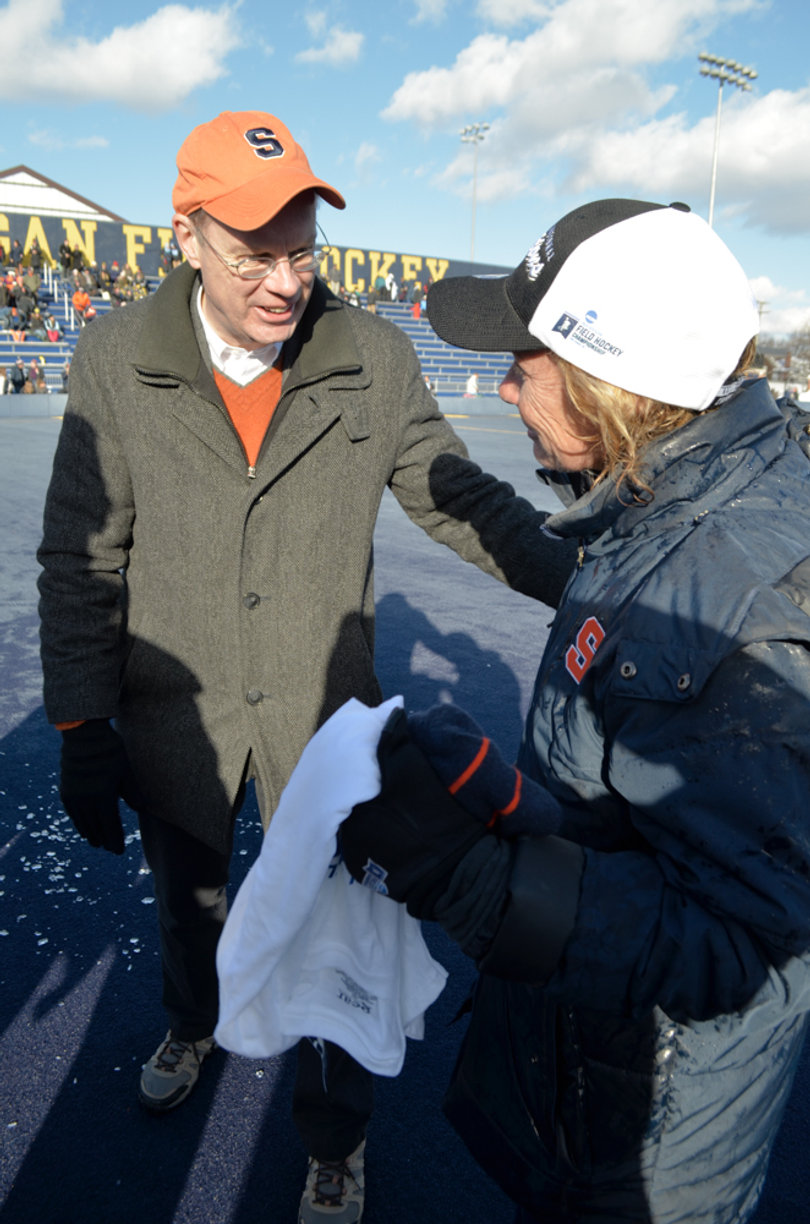 Syracuse Chancellor Kent Syverud and Bradley share a moment after the win.