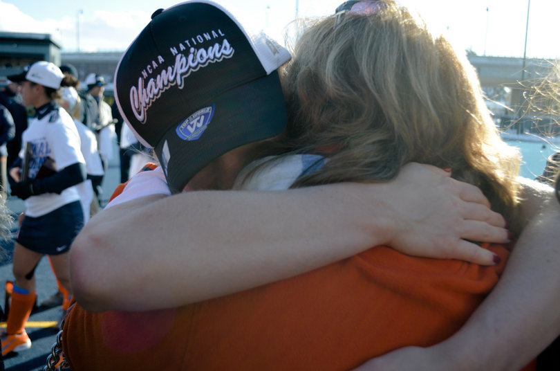 Serra Degnan hugs her mom after SU's victory.