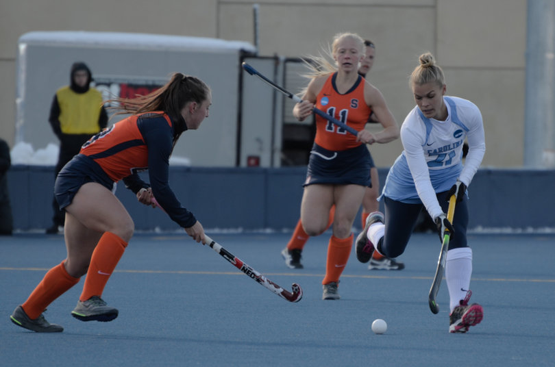 Gillingham defends against Di Nardo as Degnan looks on.