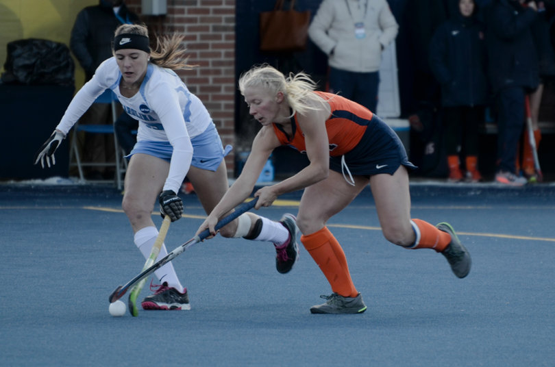 Degnan tries to keep possession as a UNC player pressures.