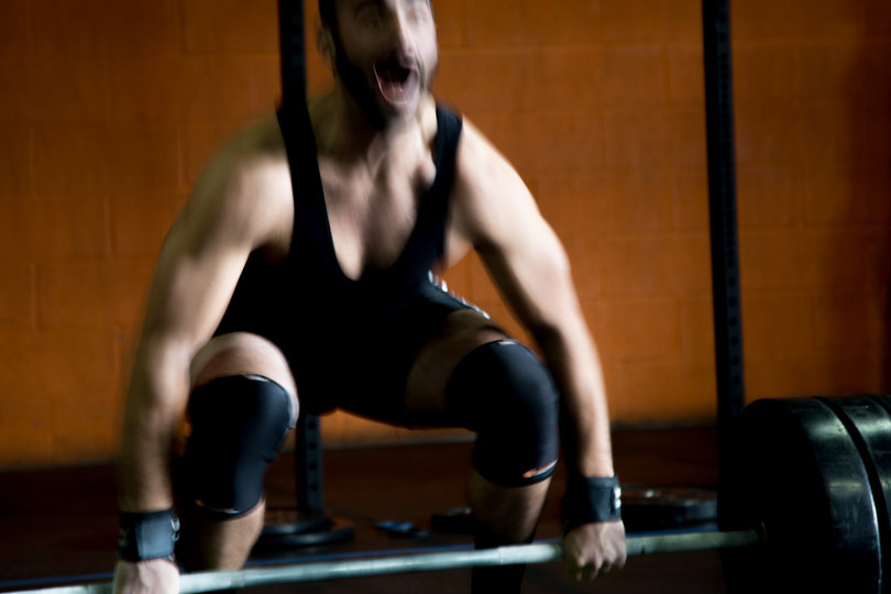 Mike Hibbard, from Canastota, New York,  does a Power Snatch at the weightlifting meet at CrossFit Syracuse.