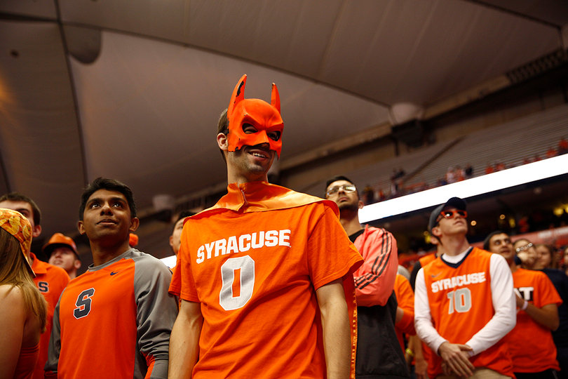 Syracuse fans look up at the video board during the Orange's game against the Badgers. 