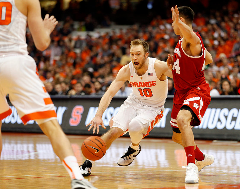 Orange guard Trevor Cooney attempts to drive around Wisconsin guard Bronson Koenig. 
