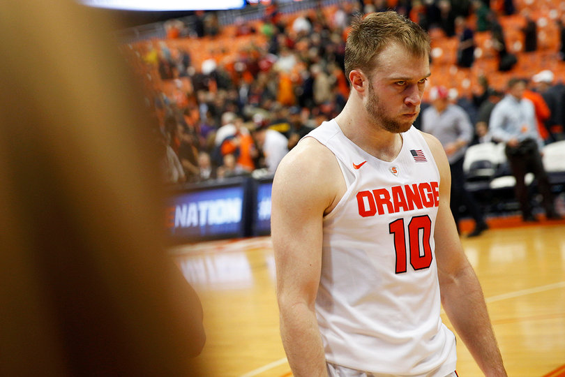Cooney walks off the court after Syracuse suffered its first loss of the season at Wisconsin. 