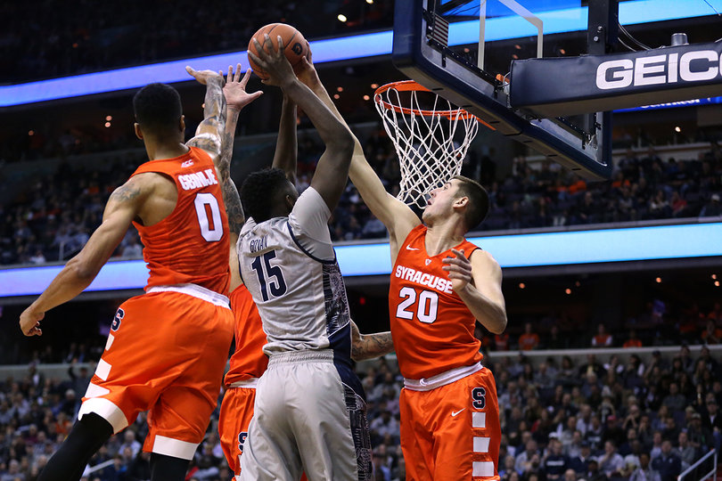 Lydon leaps to block Georgetown center Jessie Govan. The Syracuse forward tallied two blocks in the game. 