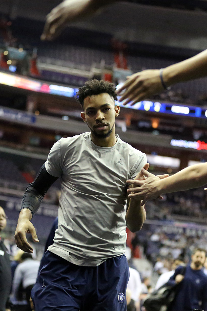 Georgetown forward Isaac Copeland shakes hands with the Hoyas' student section before the game. 