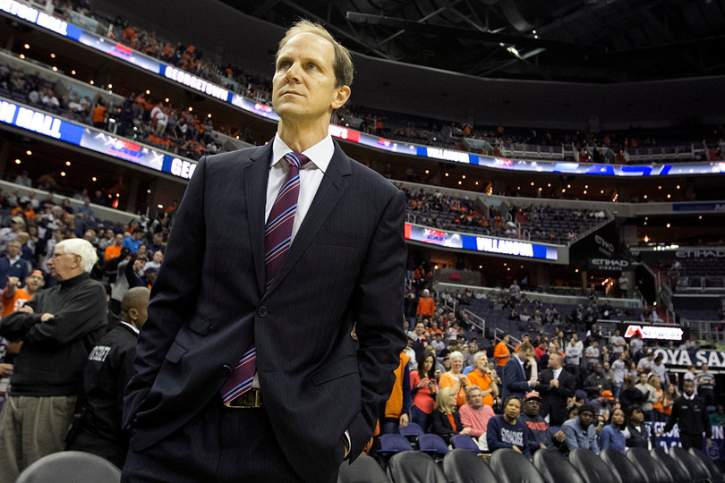 Mike Hopkins stands in front of the Syracuse bench before his first game as head coach. 