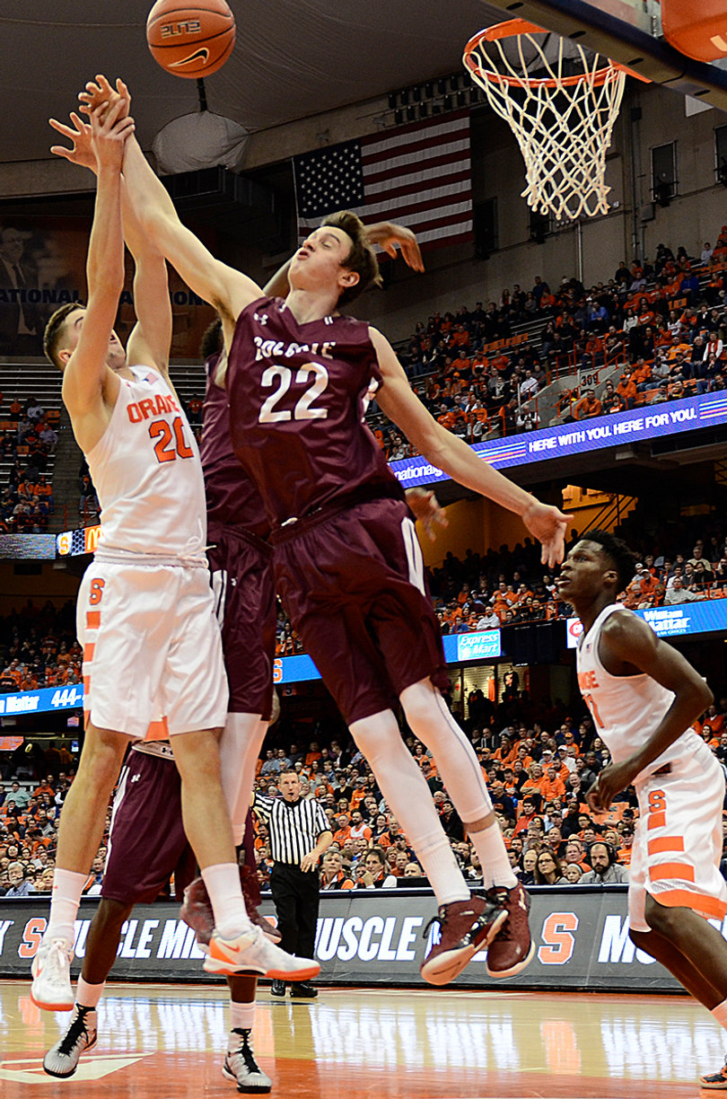 Tyler Lydon rises up for a rebound. Despite the large margin of victory, Syracuse and Colgate each grabbed 32 rebounds.