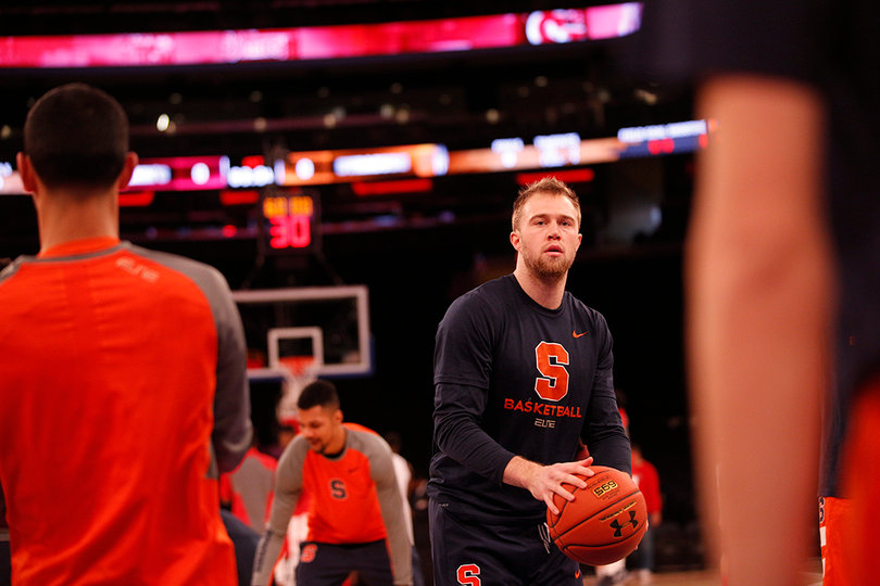 SU guard Trevor Cooney warms up before the game.