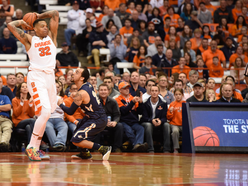 Orange center Dajuan Coleman holds the ball behind his head. He scored 13 points in 12 minutes against the Bobcats.