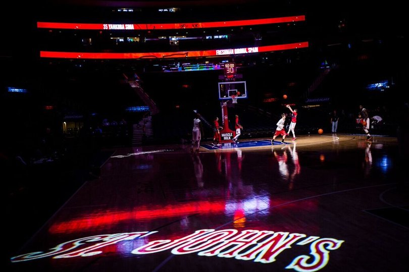 St. John's players practice before the game starts.
