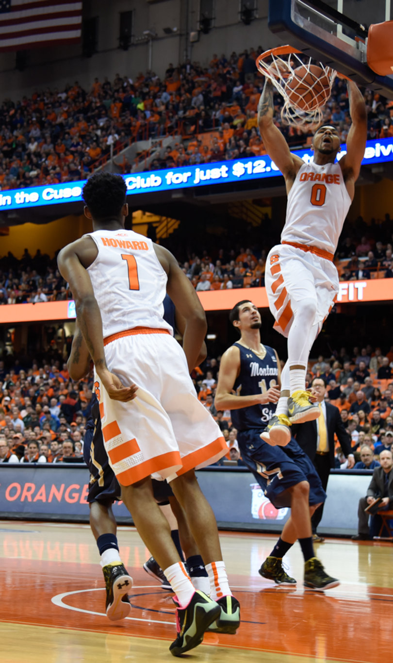 Gbinije slams home a dunk. He went 7-of-17 from the field in his 33 minutes on Tuesday night.