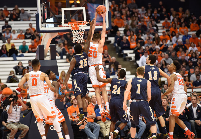 Lydon elevates for a rebound over Montana State's Shy Blake. Lydon finished with nine rebounds in total.