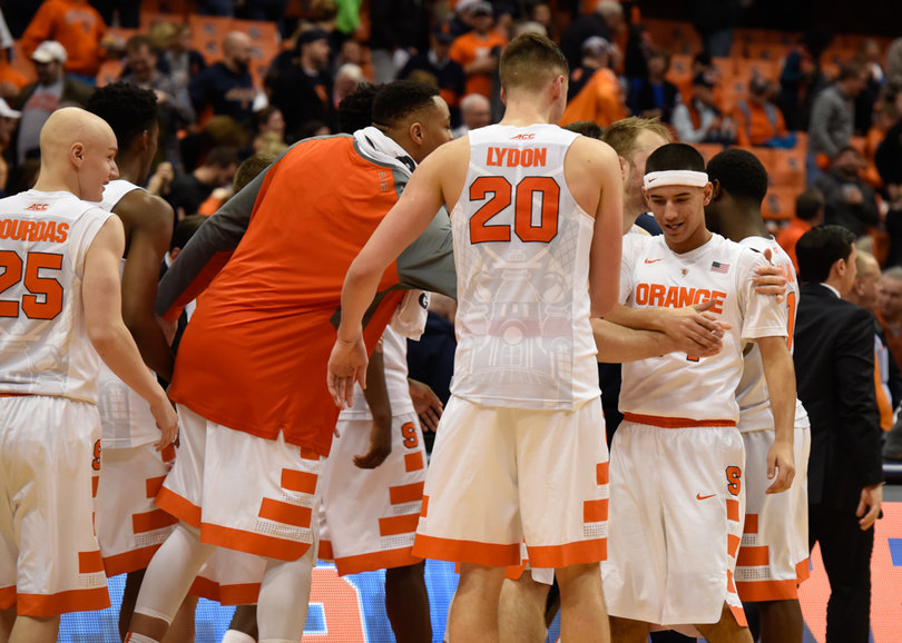 Tyler Lydon and Coleman mob Syracuse's walk-ons, who were able to get in during the closing moments of the game.