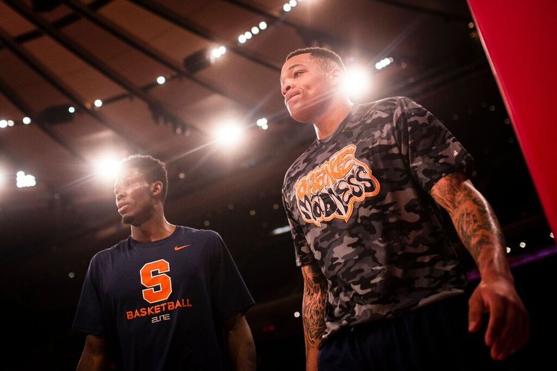 Dajuan Coleman and Chinonso Obokoh stand near the basket at Madison Square Garden.