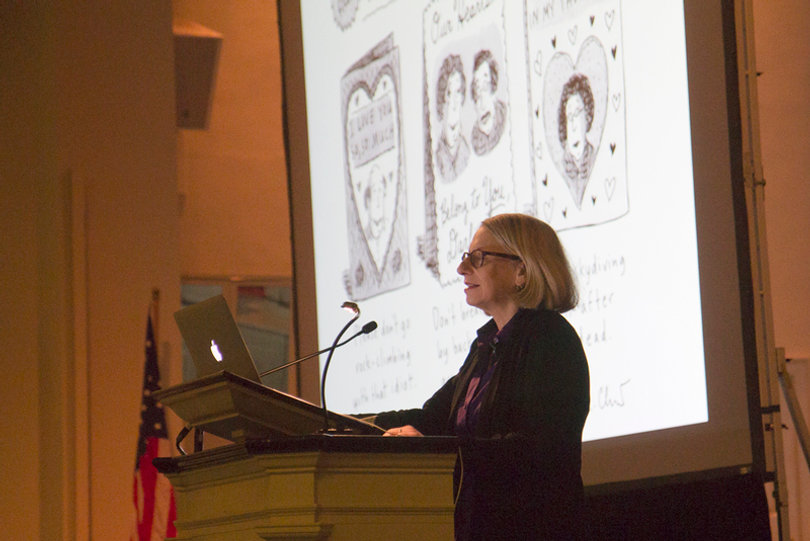 Roz Chast shows and describes one of her cartoons at her Spring 2014 lecture.