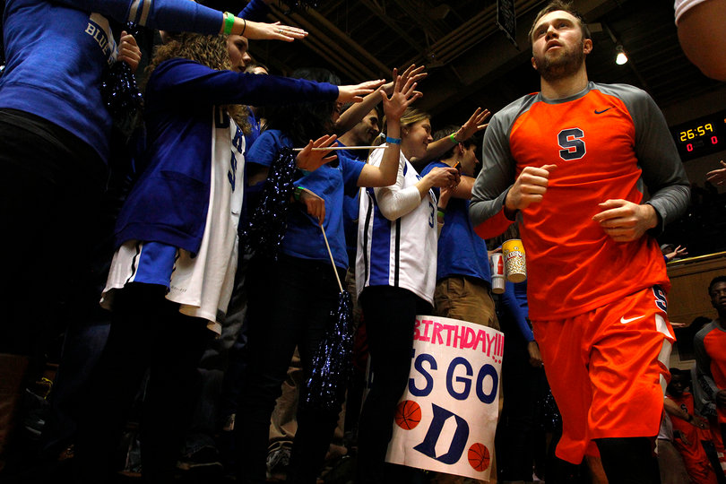Cooney jogs past several Blue Devil fans. He went 4-of-15 from the field.