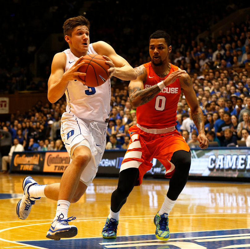 Syracuse point guard Michael Gbinije (0) chases down Duke guard Grayson Allen (3) in Gbinije's return to Cameron Indoor Stadium. 