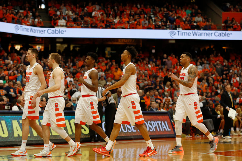 Tyler Lydon, Dajuan Coleman, Cooney, Howard and Richardson come off the court as fans remain standing in the Carrier Dome. 