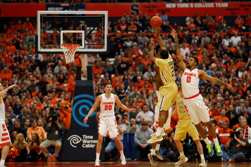 Adam Smith, a player Jim Boeheim tabbed as a danger to Syracuse, shoots while Michael Gbinije challenges Smith's shot. 