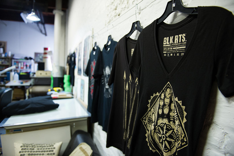 Prints from The Black Arts Studio can be found on T-shirts and posters.