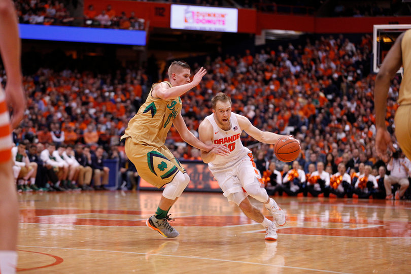 Cooney drives past Pflueger, who played in place of starting Notre Dame point guard Demetrius Jackson. 