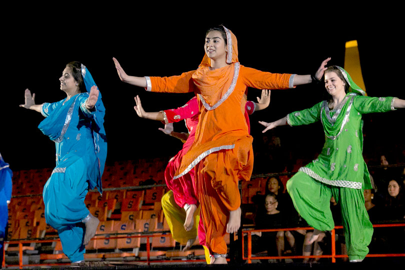 Women in colorful outfits performed dances at the celebration.