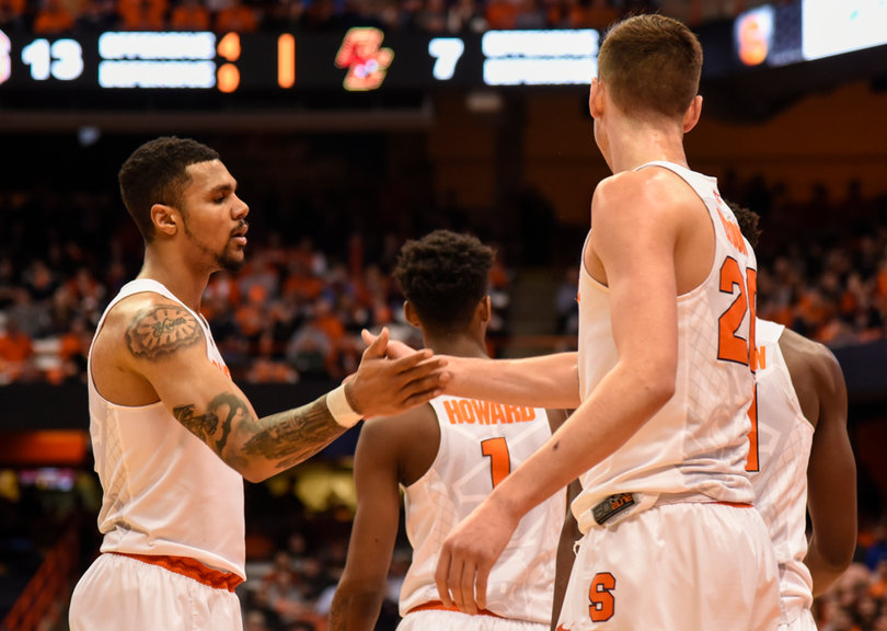 Gbinije slaps a high-five with freshman forward Tyler Lydon. Lydon had seven points in 28 minutes on Wednesday.