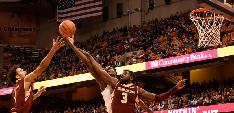 Roberson extends his right arm for a long rebound as BC's Eli Carter (3) stands in front of him.