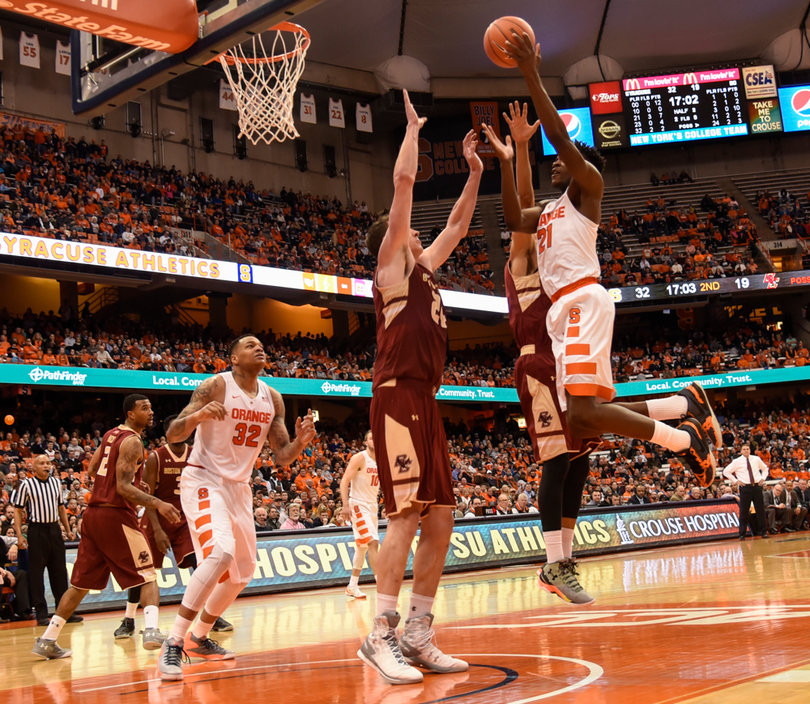 Roberson glides toward the hoop with two defenders in front of him. The junior forward finished with a solid performance, despite foul trouble.