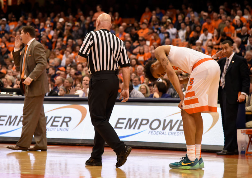 Richardson bends over during a stoppage in play. He missed a crucial free throw late in regulation that could have sealed a victory for SU. Instead, the Orange lost in overtime.