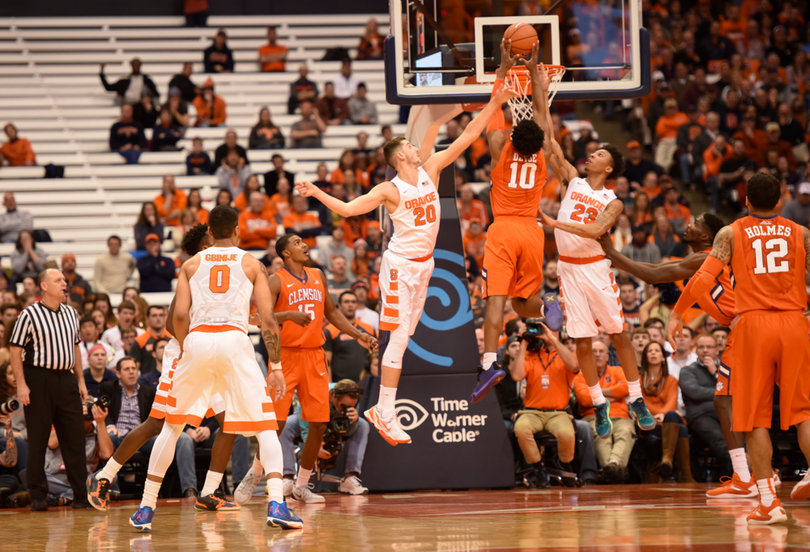 Clemson's Gabe DeVoe rises toward the rim as Lydon and Richardson try to track him down from each side. DeVoe hit an important 3 to send the game to overtime.
