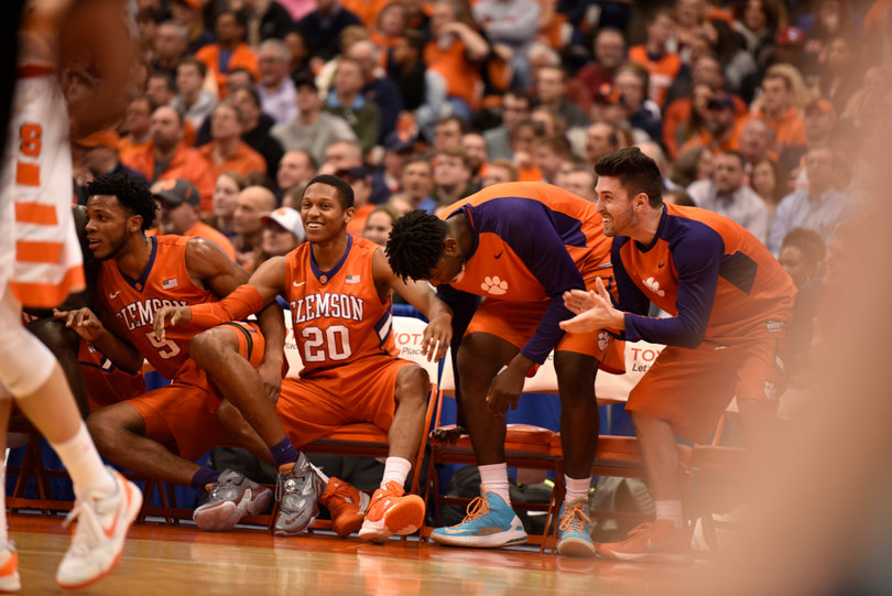 Jordan Roper (20) sits on the Clemson bench as the Tigers cheer on their teammates. Roper scored two points and had one rebound and 10 assists in 25 minutes.