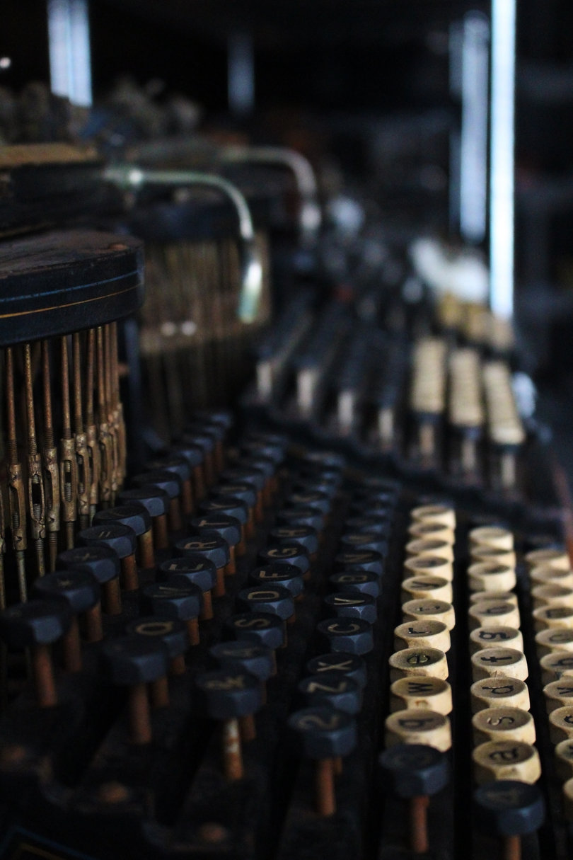 This is one of the oldest models. Most early typewriters, like this one, did not feature frontstriking keys, so the typist could not see what they were writing while working. 