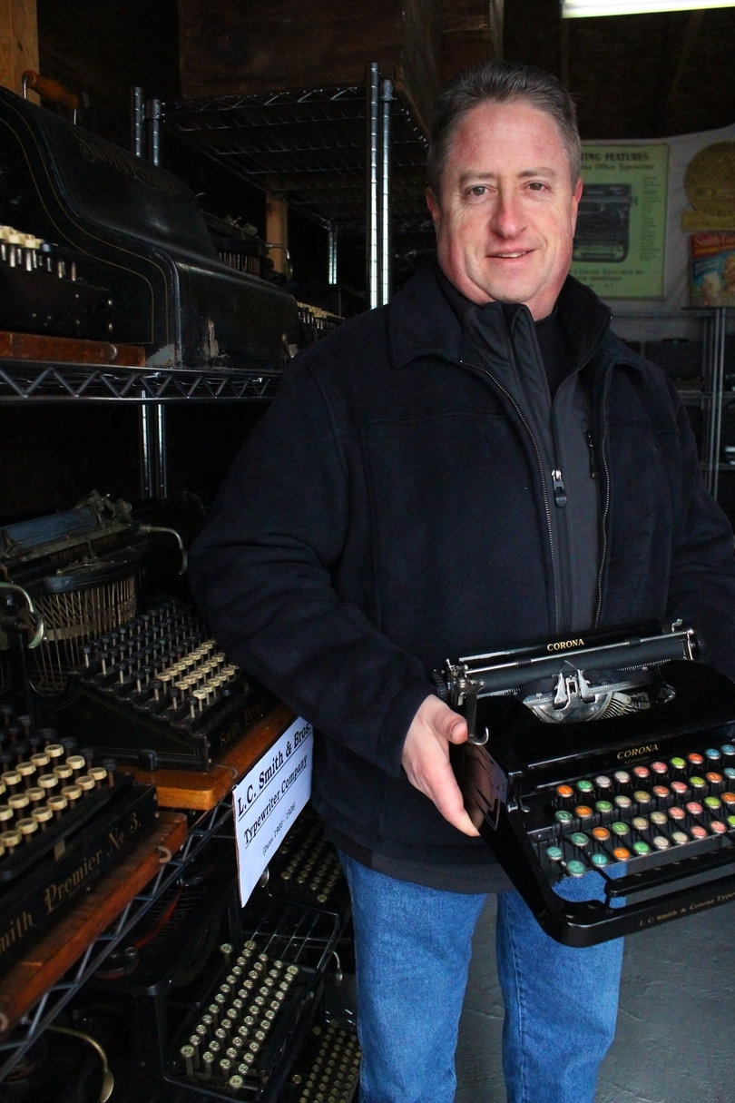 Hawxhurst shows off his favorite typewriter. It features multicolored keys. 
