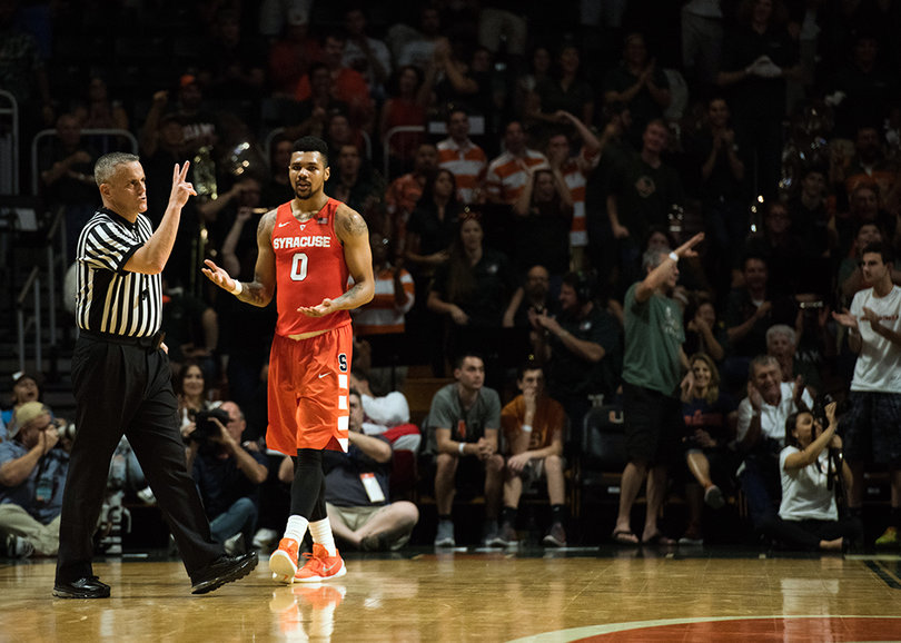 Gbinije holds his arms up after the referee makes a call. He expressed displeasure at the officiating after the game. 