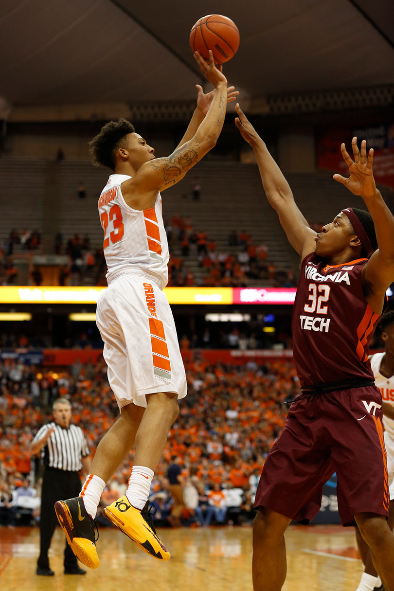 Richardson fires a shot over LeDay and hit just 25 percent of his shots from the field and beyond the 3-point line. 