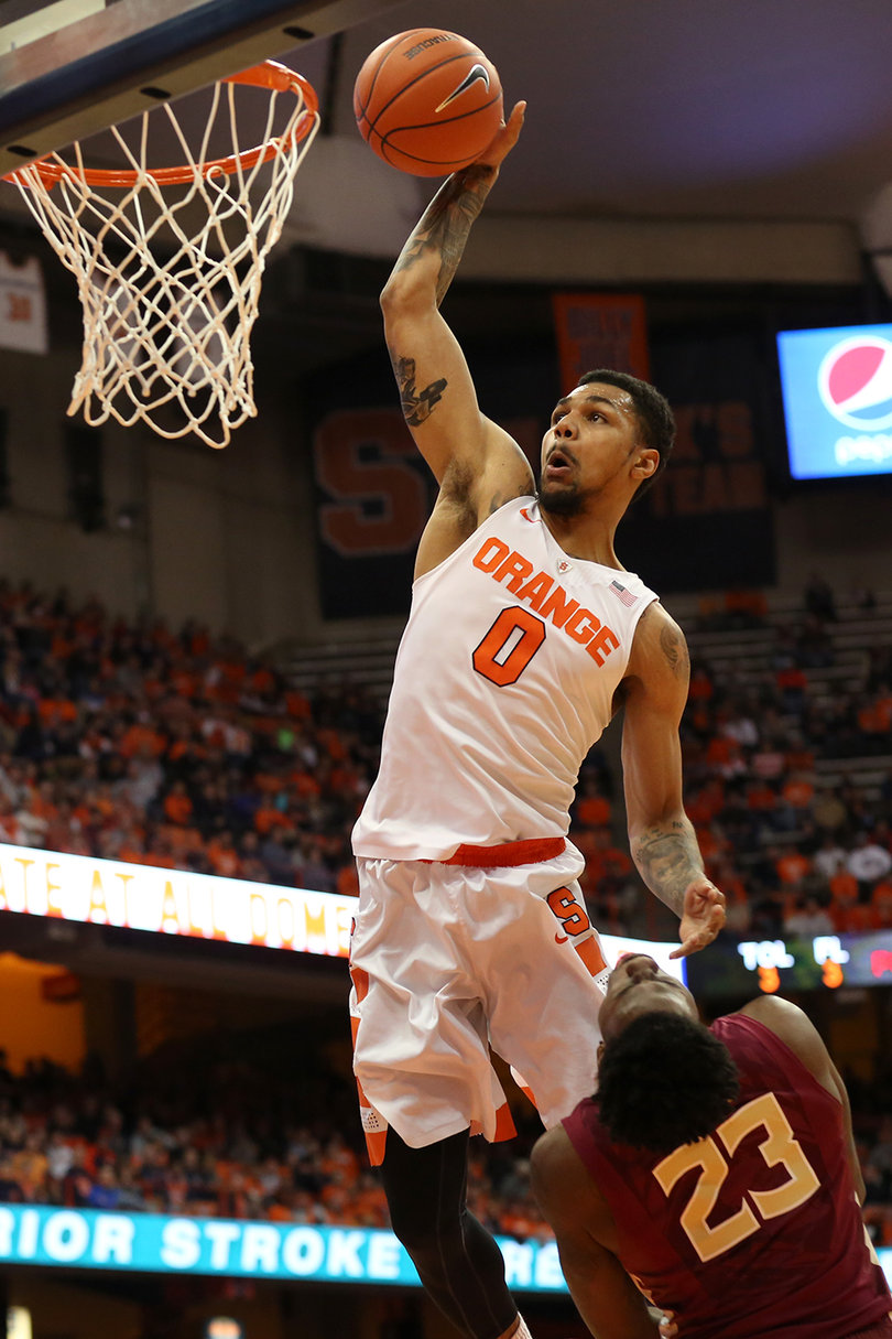 Michael Gbinije rises up with the ball in his right hand prepping to dunk. The fifth-year senior scored 22 points.