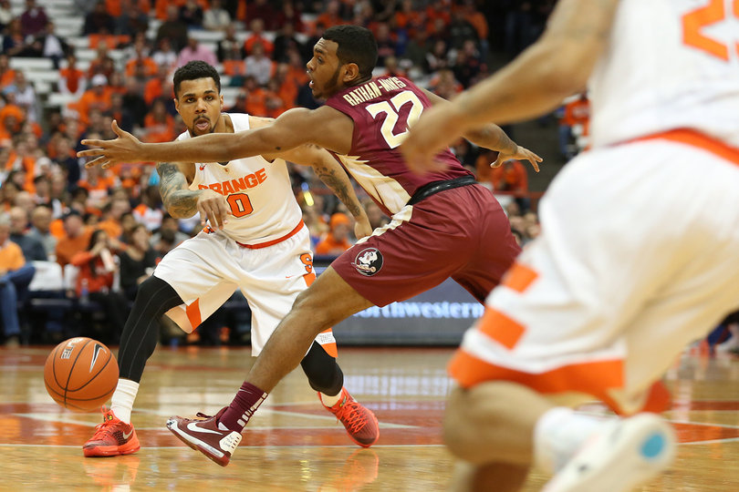 Gbinije looks past the outstretched arm of a Florida State defender.