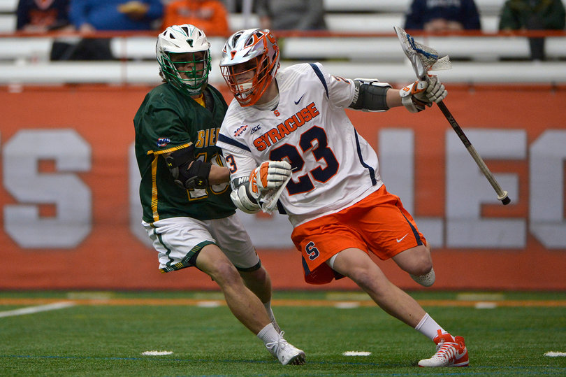 Mariano runs past a Siena defender while keeping his eyes upfield.