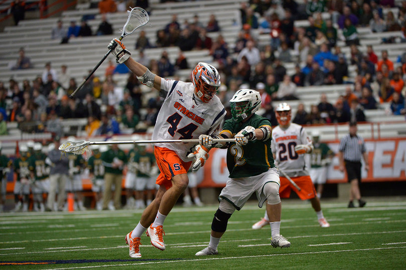 Matt Lane uses his 6-foot-7 frame to shield the ball away from a Siena defender. 