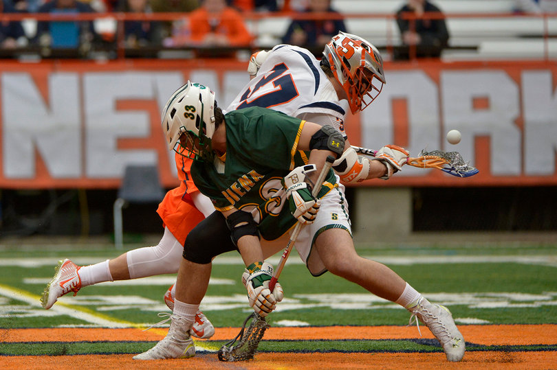 Siena's Hunter Sanna stares toward the ground after Syracuse's Ben Williams won a faceoff.