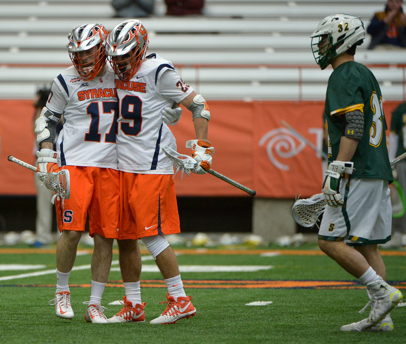 Donahue hugs Piroli after a goal. The duo combined for six goals on the day.