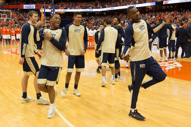 Pittsburgh players dance while wearing warmup suits.