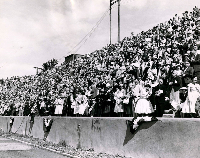 A crowd of about five thousand people, including 1,627 degree candidates in Syracuse University's class of 1957, fill Archbold Stadium during graduation.